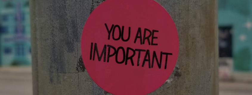 Sticker on lamp post reading 'you are important'